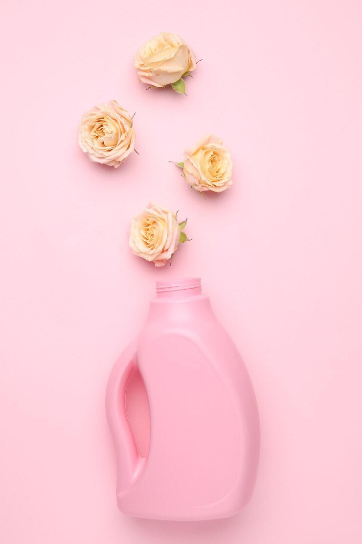 bottle laundry detergent flowers pink background closeup 495423 104936