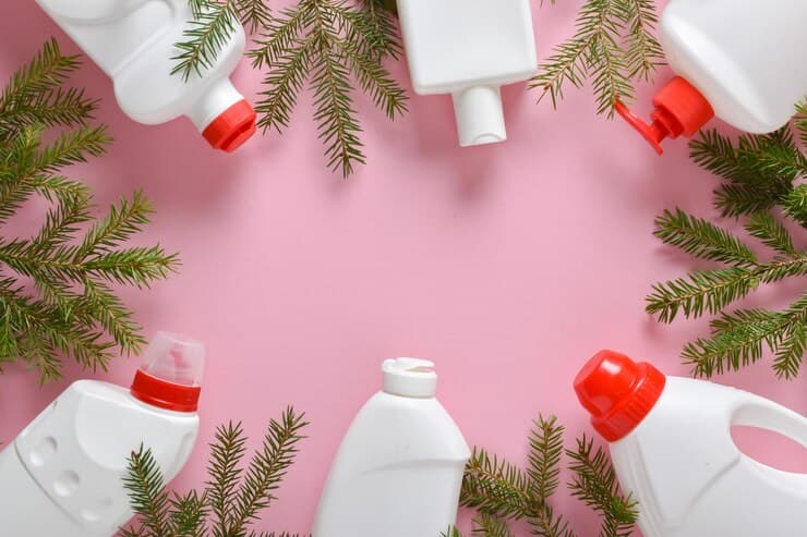 christmas cleaning plastic white bottles with detergent disinfection fir branches christmas tree toys light pink background 261761 2904 1