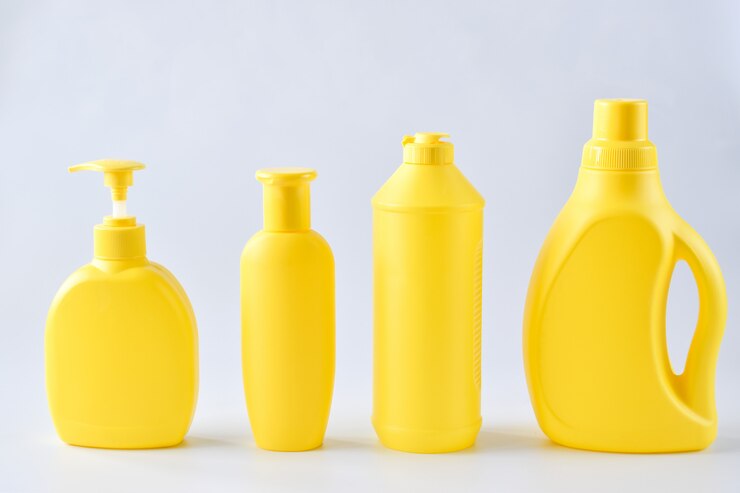 close-up-four-yellow-plastic-bottles_261761-196