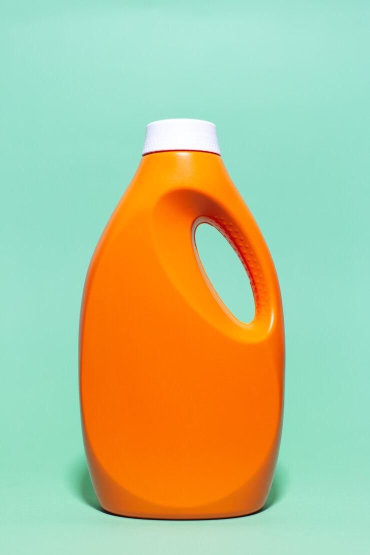 close up orange detergent bottle wall aqua menthe color 379201 397