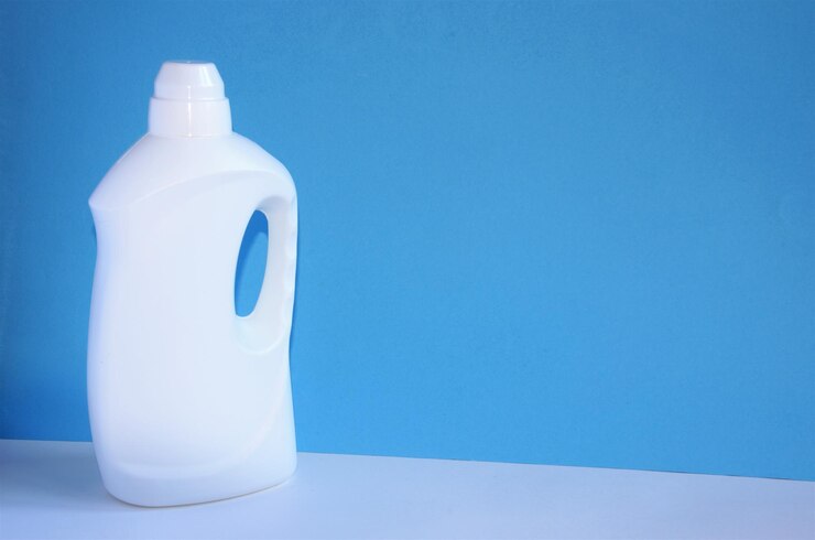 close-up-white-bottle-against-blue-background_1048944-21062422