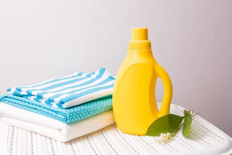 clothes-lily-valley-flower-fabric-softener-bottle-without-label-basket_286227-1884 (1)
