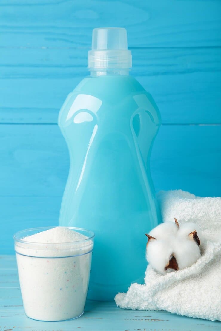 eco washing concept laundry detergent cotton flowers blue towel grey background copy space vertical photo 106006 9613 1