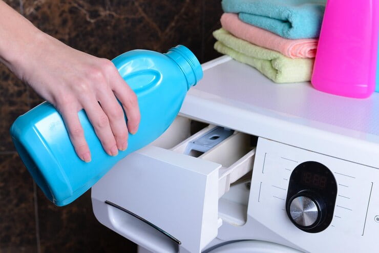 female hands poured powder washing machine closeup 392895 350386 1