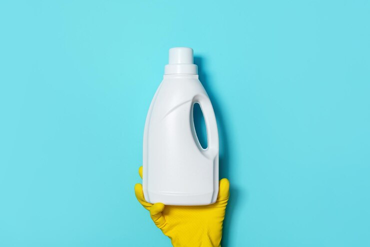 hand-glove-holding-white-plastic-bottle-cleaning-product-household-chemicals-copy-space-cleaning-service-concept-household-chemical-cleaning-products-brushes-supplies-detergent-bottle_769609-2283