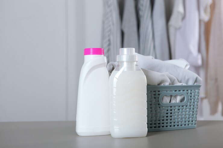 laundry detergent bottles clothes table household chemicals 441923 13308
