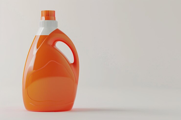 orange laundry detergent bottle white surface 1204564 189095