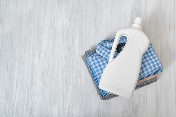 stack-folded-clothes-detergent-bottle-top-view_134398-3918 (1)