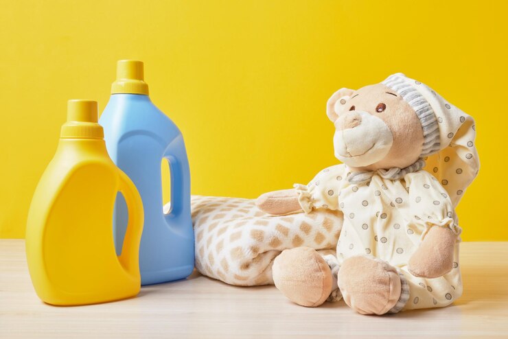 teddy bear bottles with washing gel yellow background washing baby clothes concept 1048944 7590062
