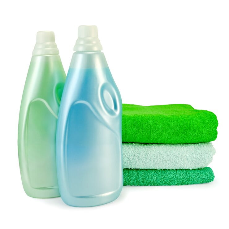 two bottles fabric softener blue green colors three towel isolated 423299 970 2 1