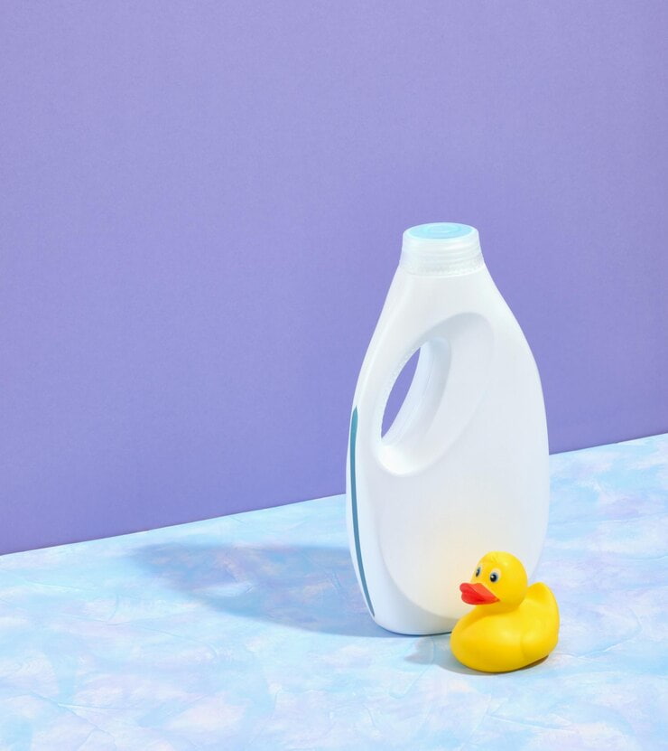 white big bottle laundry detergent shadow yellow little rubber duck table space text 594847 2076 1