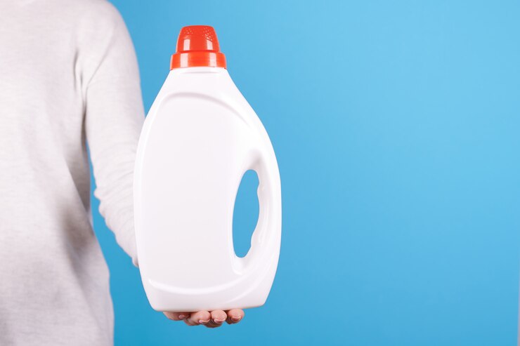 white bottle with liquid detergent woman s hand 96930 734